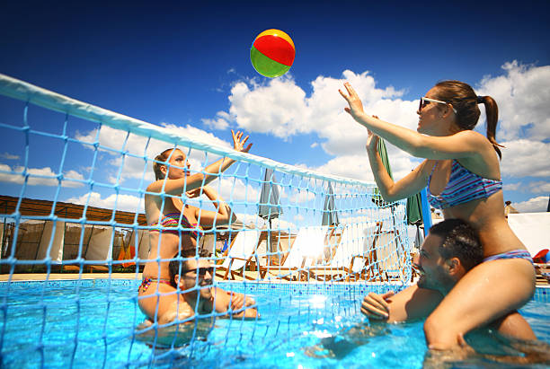 istock Friends playing volleybay in a pool. 478801290
