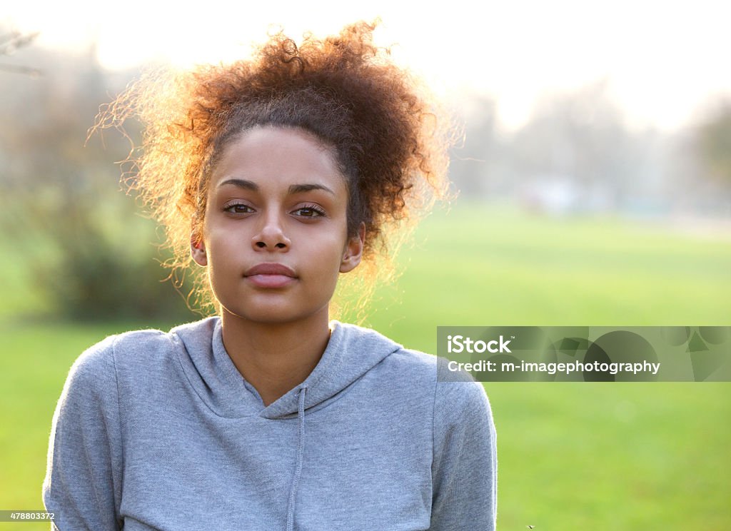 Attractive young sports woman outdoors Close up portrait of an attractive young sports woman outdoors Serious Stock Photo