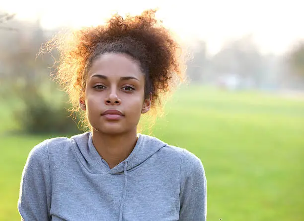 Close up portrait of an attractive young sports woman outdoors