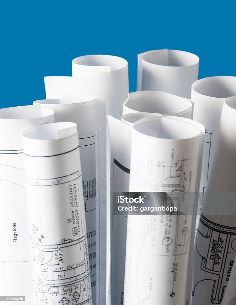rolls of architecture blueprints and house plans rolls of architecture blueprints and house plans on the table Architecture Stock Photo