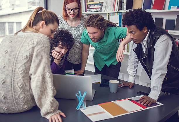 istock Start-up team using laptop together in the office. 478803786