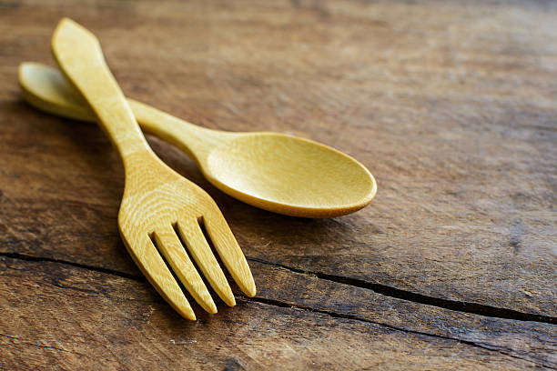 istock wood spoon and fork on old wooden table 478803860