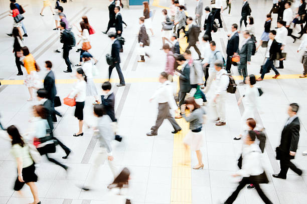 istock Motion blurred crowded pedestrian walkway, business people, Tokyo 478804084
