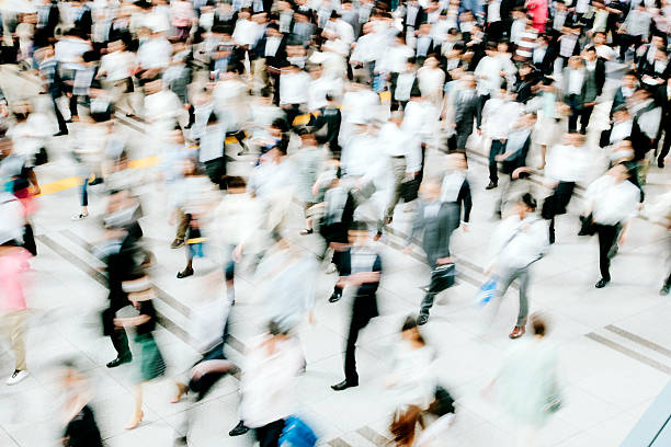 istock Motion blurred crowded pedestrian walkway, business people, Tokyo 478804106