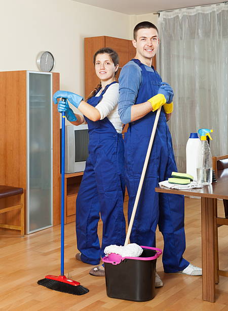 istock Two happy cleaners cleaning floor 478804113