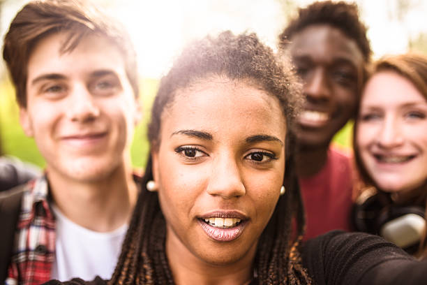istock Group of college student laughing and doing a selfie 478806868