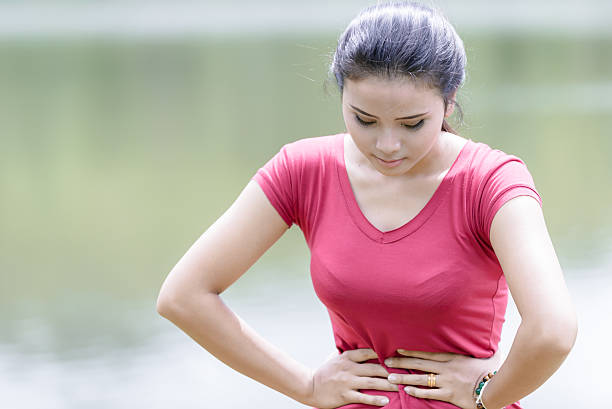 istock Young beautiful woman is having stomach ache 478807468