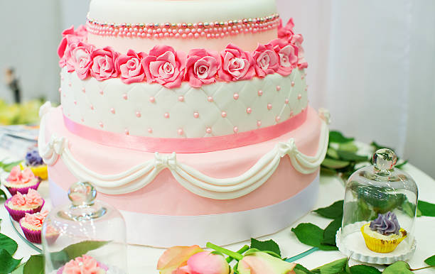 istock Wedding cake decorated with pink roses 478807853