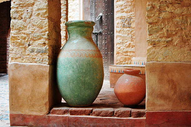 Subject: A display of a collection of Chinese antique potteries and furniture.
