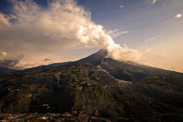 Tungurahua Volcano Powerful Explosion Tungurahua volcano explosion on february 2014 at sunset mt tungurahua sunset mountain volcano stock pictures, royalty-free photos & images