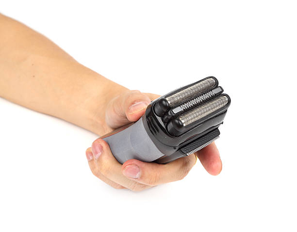 istock hand with electric shaver 478810394