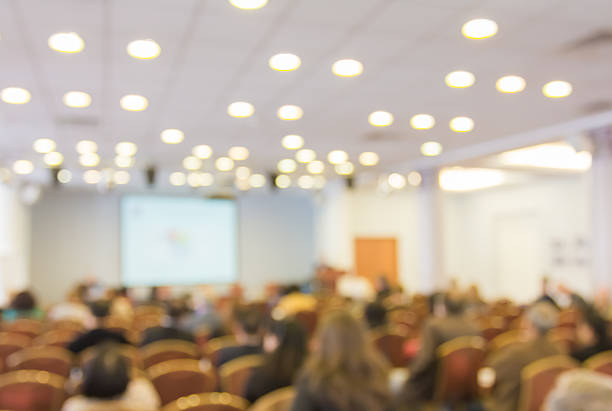 istock Blurred image of people in auditorium , blur background 478810450