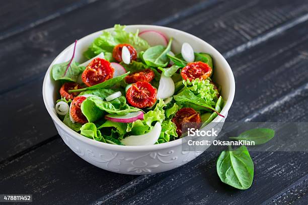 Salad With Fresh Vegetables Garden Herbs And Sundried Tomatoes Stock Photo - Download Image Now