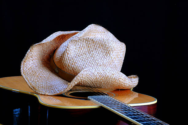 cowboy hat on guitar stock photo