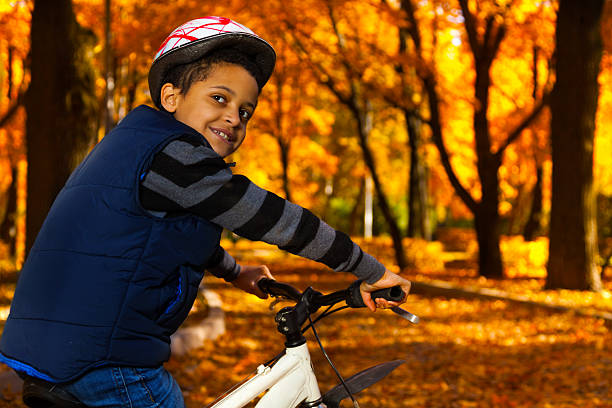 istock Boy in helmet on the bike 478811979
