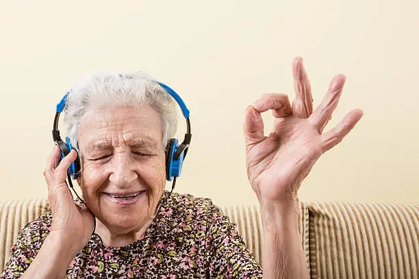 Photo of senior woman listening music