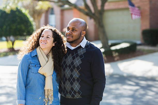 istock Black couple standing outdoors on residential street 478815464