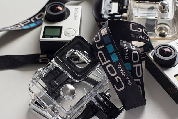 Shanghai, China - June 4, 2015: Comparing GoPro Cameras with GoPro strap on white background. GoPro Hero 4 and GoPro Hero 3+. Photo taken Shanghai, China. 