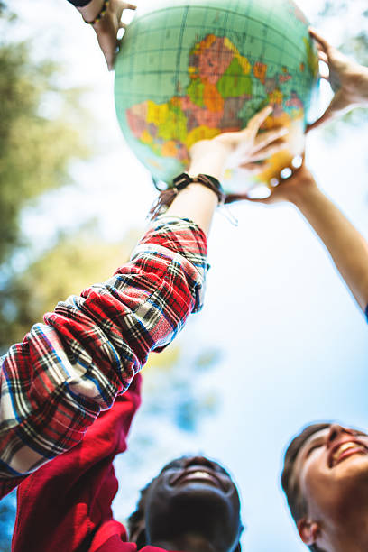 istock teenagers college student smiling with globe 478824698