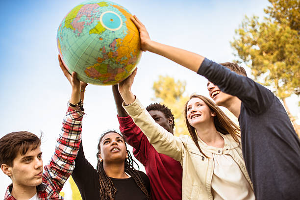 istock teenagers college student smiling with globe 478824702