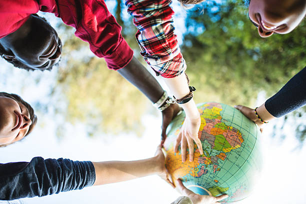 teenagers college student smiling with globe