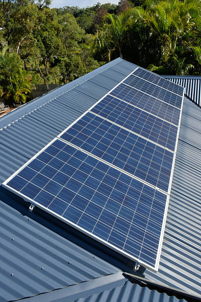 istock Row of solar panels on a house roof 478824774
