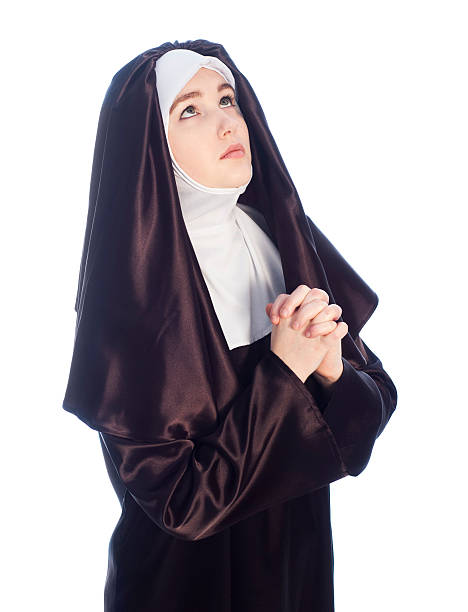 若い魅力的な修道女ます。 - nun catholicism praying women ストックフォトと画像