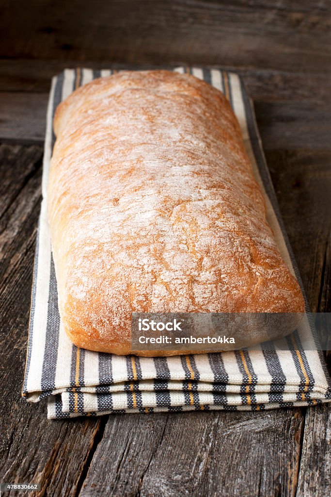 Fresh bread  on the  wooden table Crusty Homemade Ciabatta Bread Ready to Eat 2015 Stock Photo