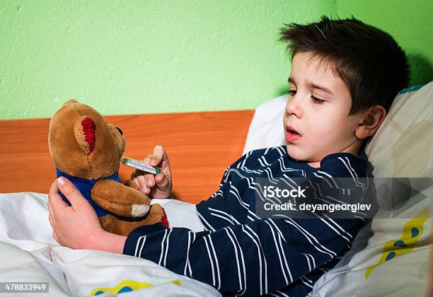 Sick Child In Bed With Teddy Bear Stock Photo - Download Image Now - Bed - Furniture, Boys, Care