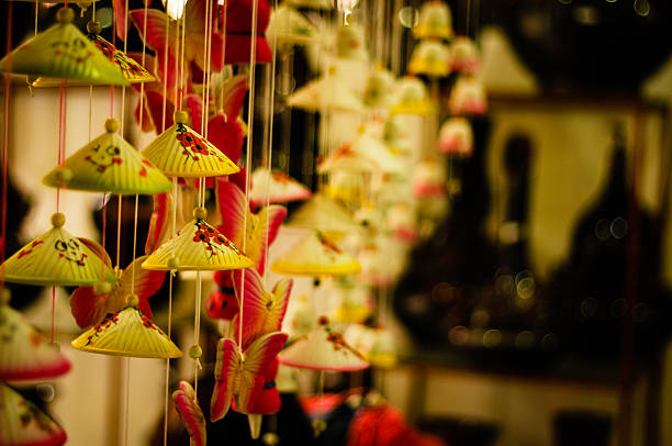 Wind bell in Bat Trang village - Vietnam Bát Tràng (literally: bát is bowl and tràng is workshop) is an old, well established village in the Gia Lâm district of Hanoi, the capital city of Vietnam. It is about 13 km from central Hanoi. bat trang stock pictures, royalty-free photos & images