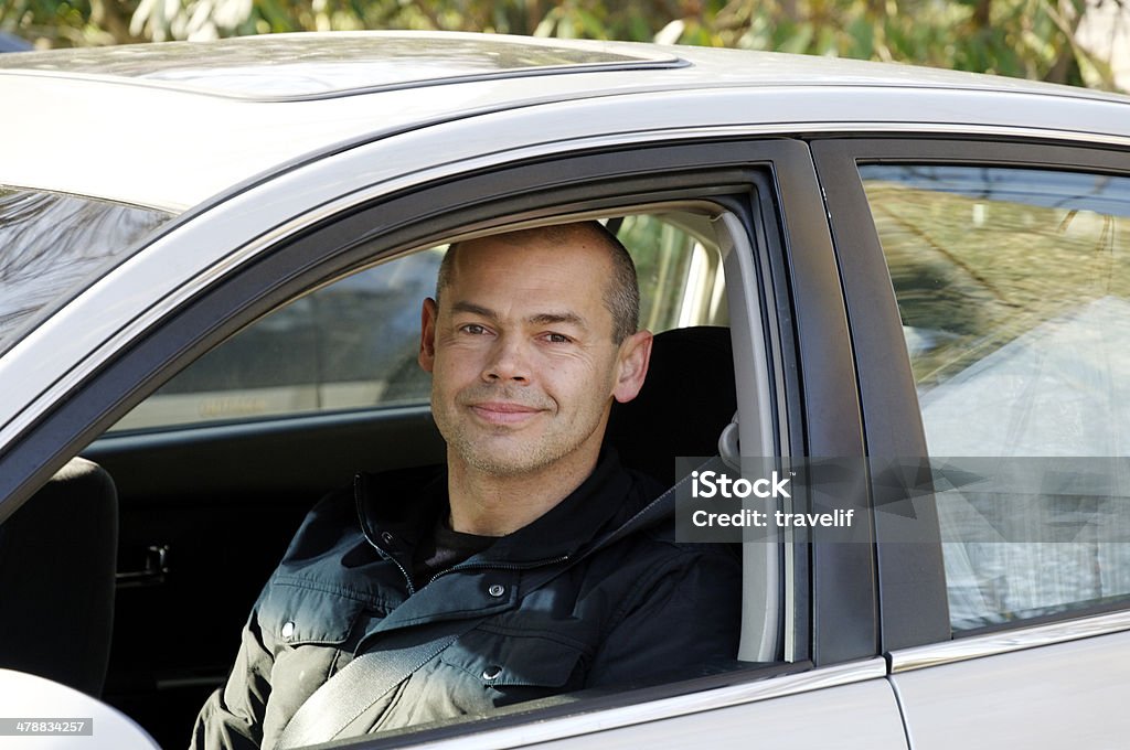 Man in car window - ready to go 'On the road" lightbox: Car Stock Photo