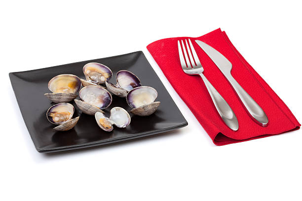 istock Cooked Manila clams on a black plate 478835267