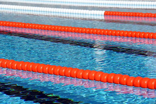 Swimming pool lanes View of lane rope in an outside Olympic pool. swimming pool lane ropes stock pictures, royalty-free photos & images