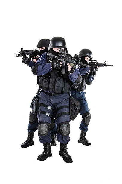 SWAT team in action Special weapons and tactics (SWAT) team in action gun laws stock pictures, royalty-free photos & images