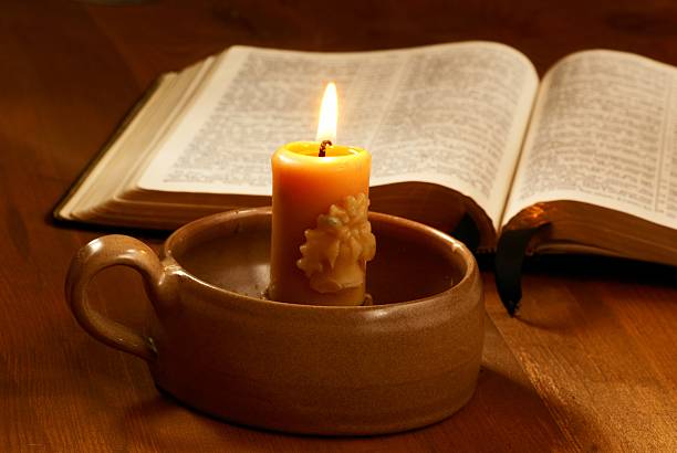 istock Candle and Holy Bible 478837365