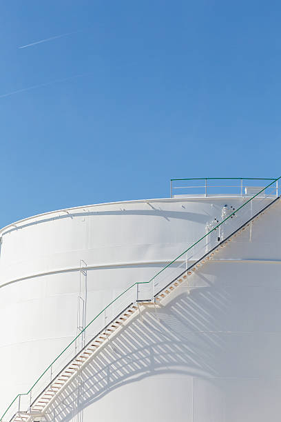 istock white tanks in tank farm with iron staircase 478838258