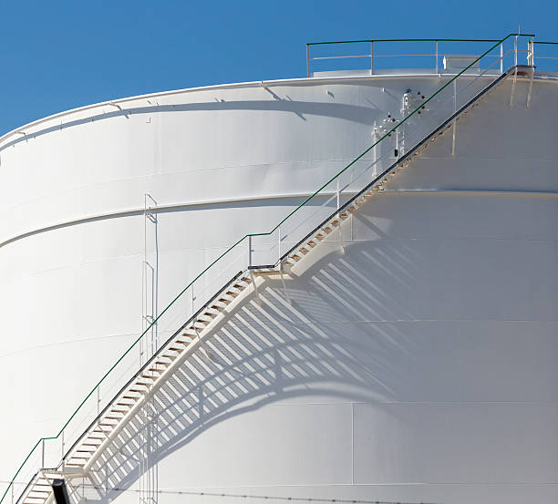 istock white tanks in tank farm with iron staircase 478839316