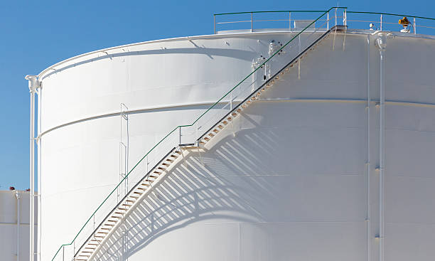 istock white tanks in tank farm with iron staircase 478839318