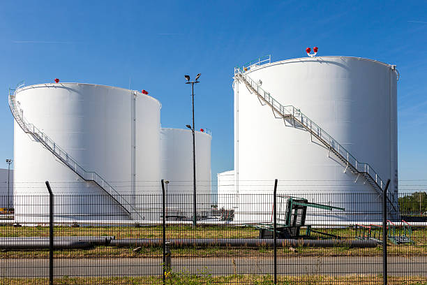 istock white tanks in tank farm with iron staircase 478839322