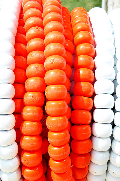 Swimming pool lane Ropes Roll of white and orange swimming pool ropes. swimming pool lane ropes stock pictures, royalty-free photos & images
