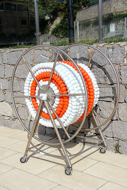 Swimming pool lane Ropes Roll of white and orange swimming pool ropes. swimming pool lane ropes stock pictures, royalty-free photos & images