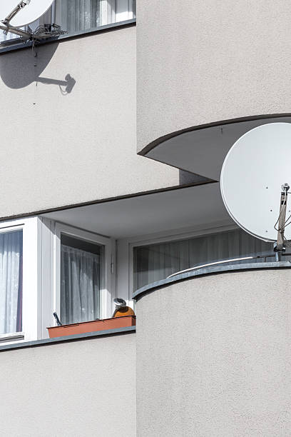 sparse balcony with satellite dishes shoot in berlin germany sparse balcony with satellite dishes shoot in berlin germany. parabol stock pictures, royalty-free photos & images