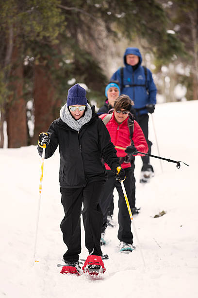 istock Snow Shoeing Through the Woods 478842423