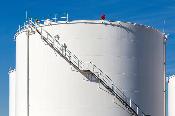 istock white tanks in tank farm with iron staircase 478842482