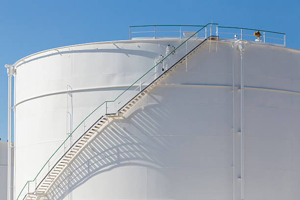 istock white tanks in tank farm with iron staircase 478842484