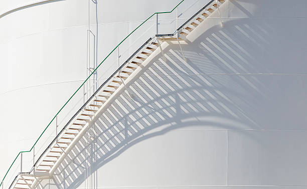 istock white tanks in tank farm with iron staircase 478842488