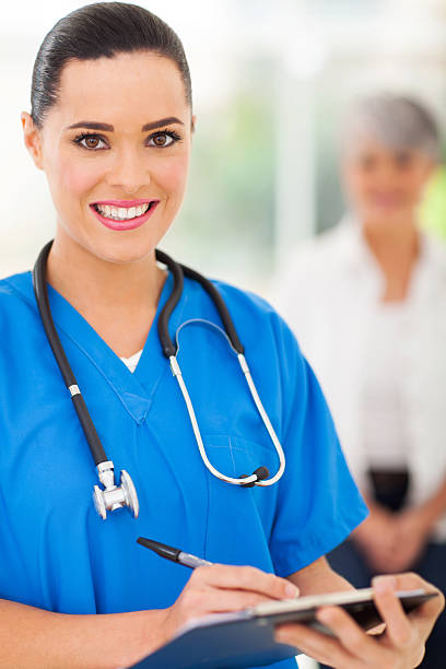 istock female  doctor writing on clipboard 478842901