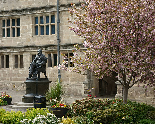 Darwin's statue under flowering cherrytree in home town Shrewsbury, UK. stock photo