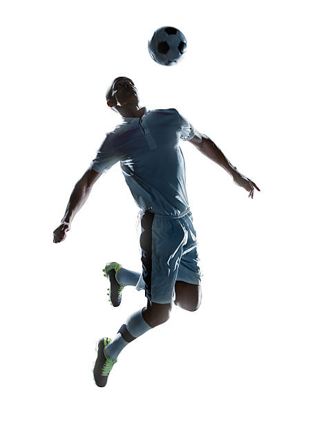 サッカー選手の足蹴りボール - soccer player men flying kicking ストックフォトと画像