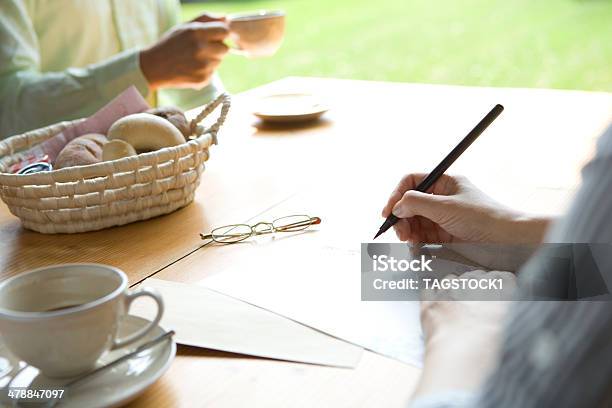 Hand Of Senior Woman Writing Letter Stock Photo - Download Image Now - Writing - Activity, Letter - Document, Senior Couple